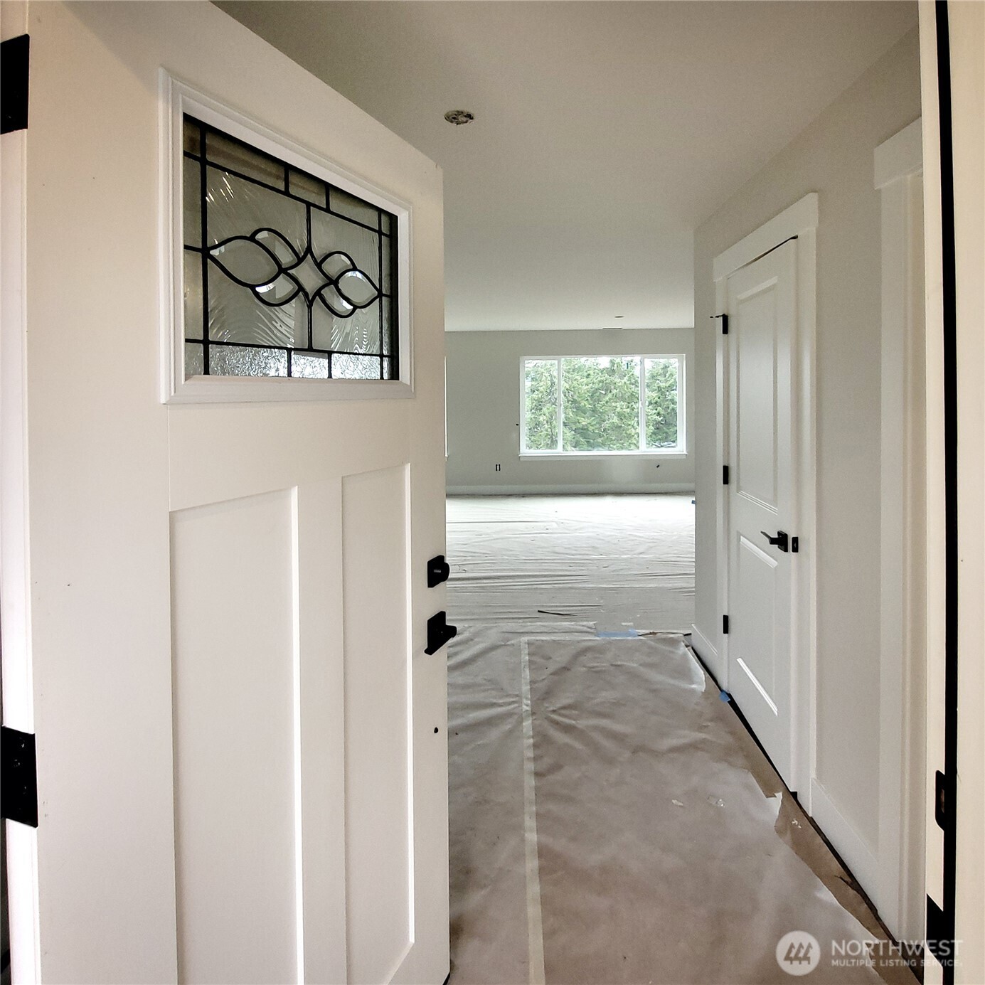 320 East 4th Street Union, WA 98592 - Photo 2 of 35 a view of a hallway with paintings on the wall
