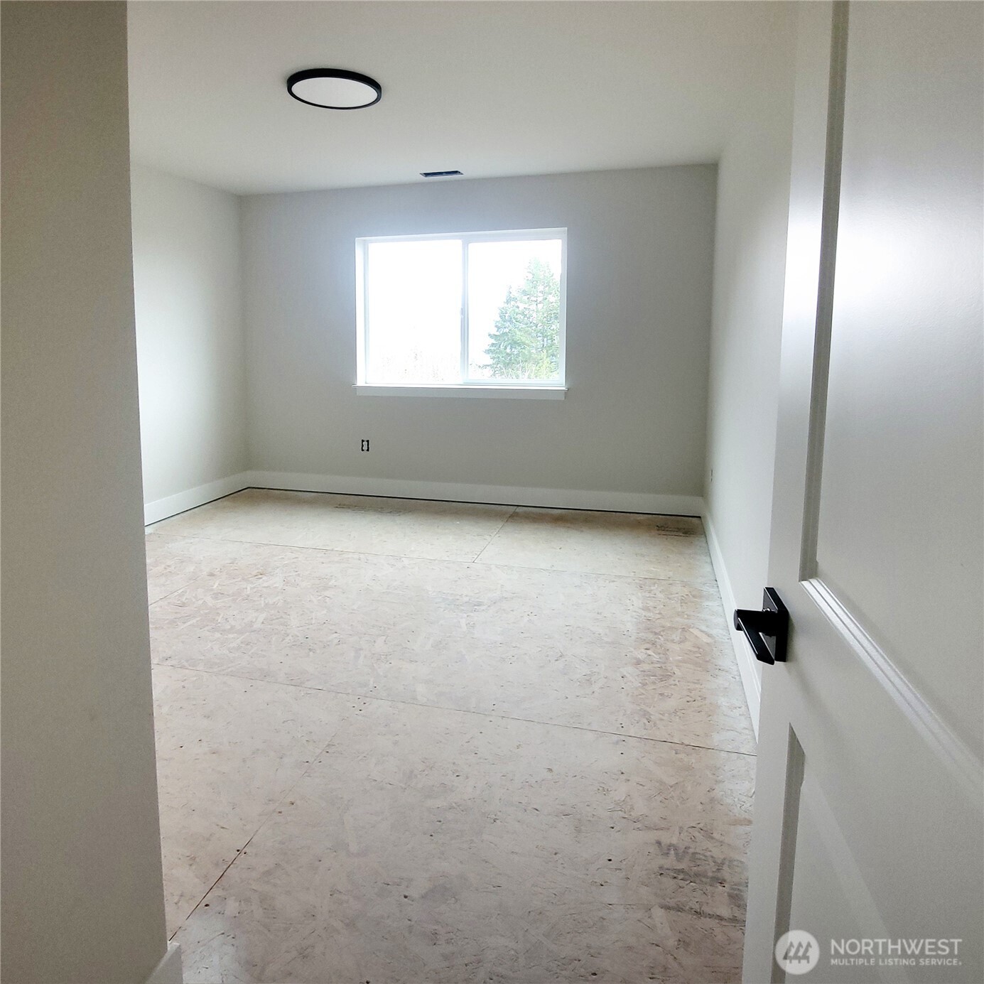 320 East 4th Street Union, WA 98592 - Photo 22 of 35 a view of an empty room with a window
