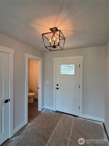 a kitchen with cabinets a sink and appliances