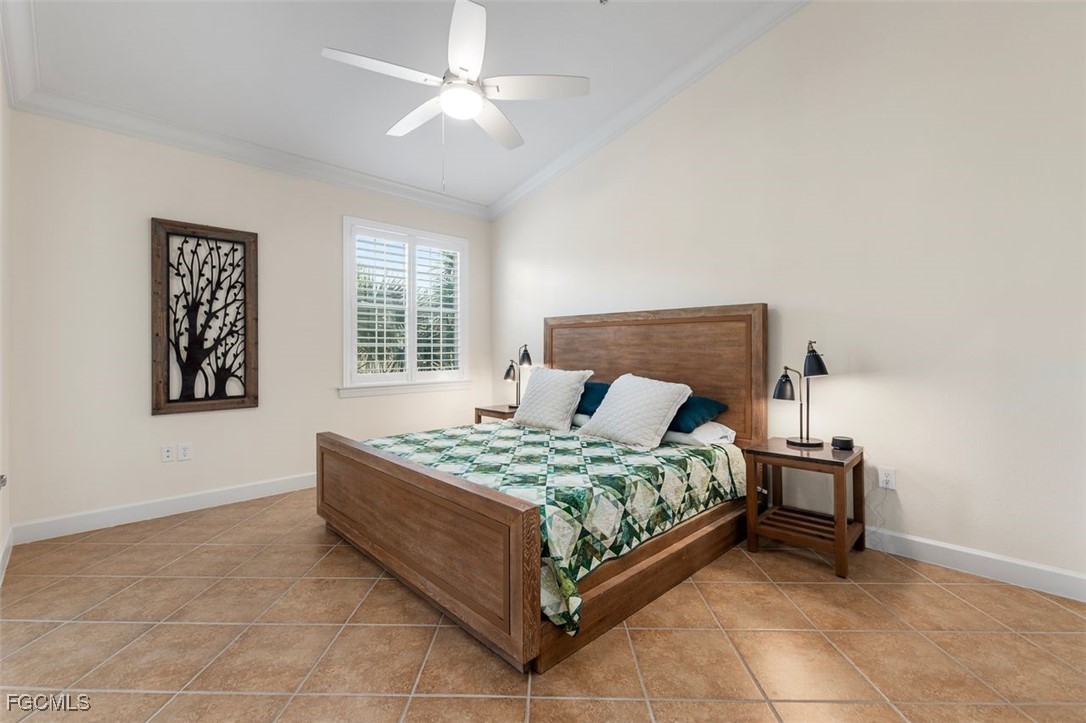 13071 Pebblebrook Point Circle, Unit 201 Fort Myers, FL 33905 - Photo 17 of 41 a bedroom with a bed and a window
