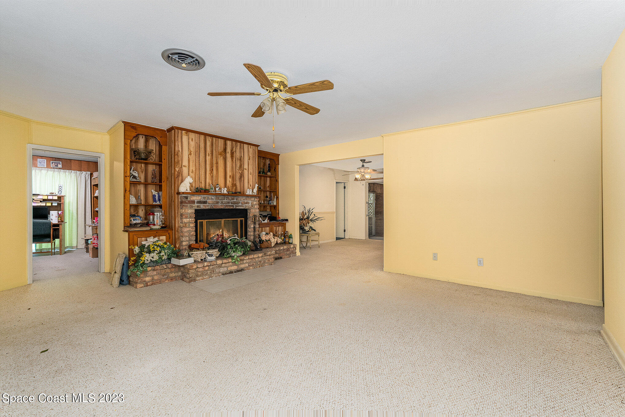3395 Turtle Mound Road Melbourne, FL 32934 - Photo 21 of 48 a view of a livingroom with fireplace