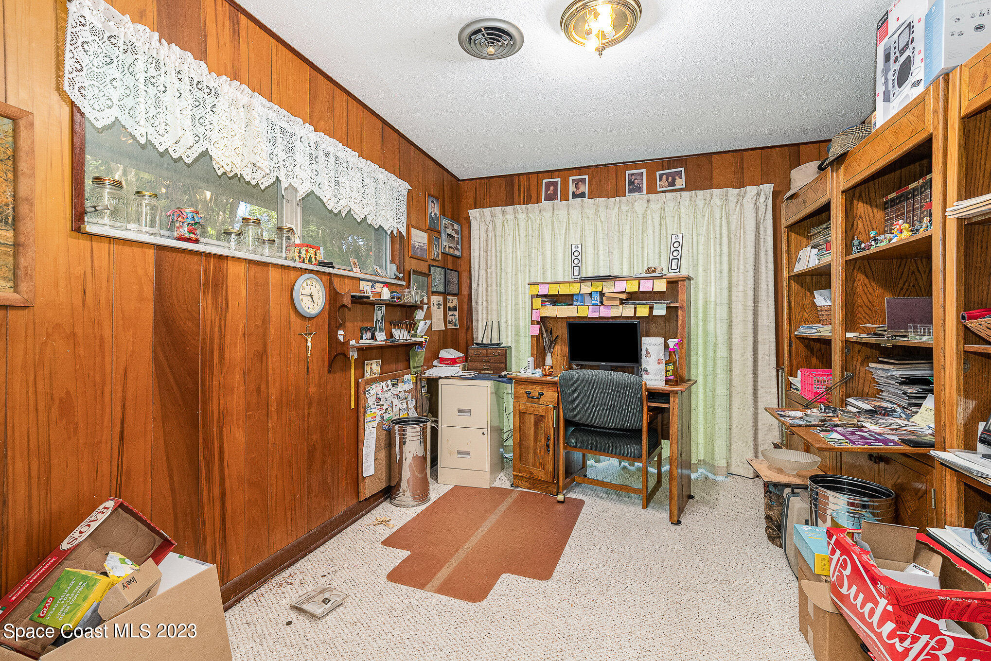 3395 Turtle Mound Road Melbourne, FL 32934 - Photo 22 of 48 a bedroom with a bed and a window