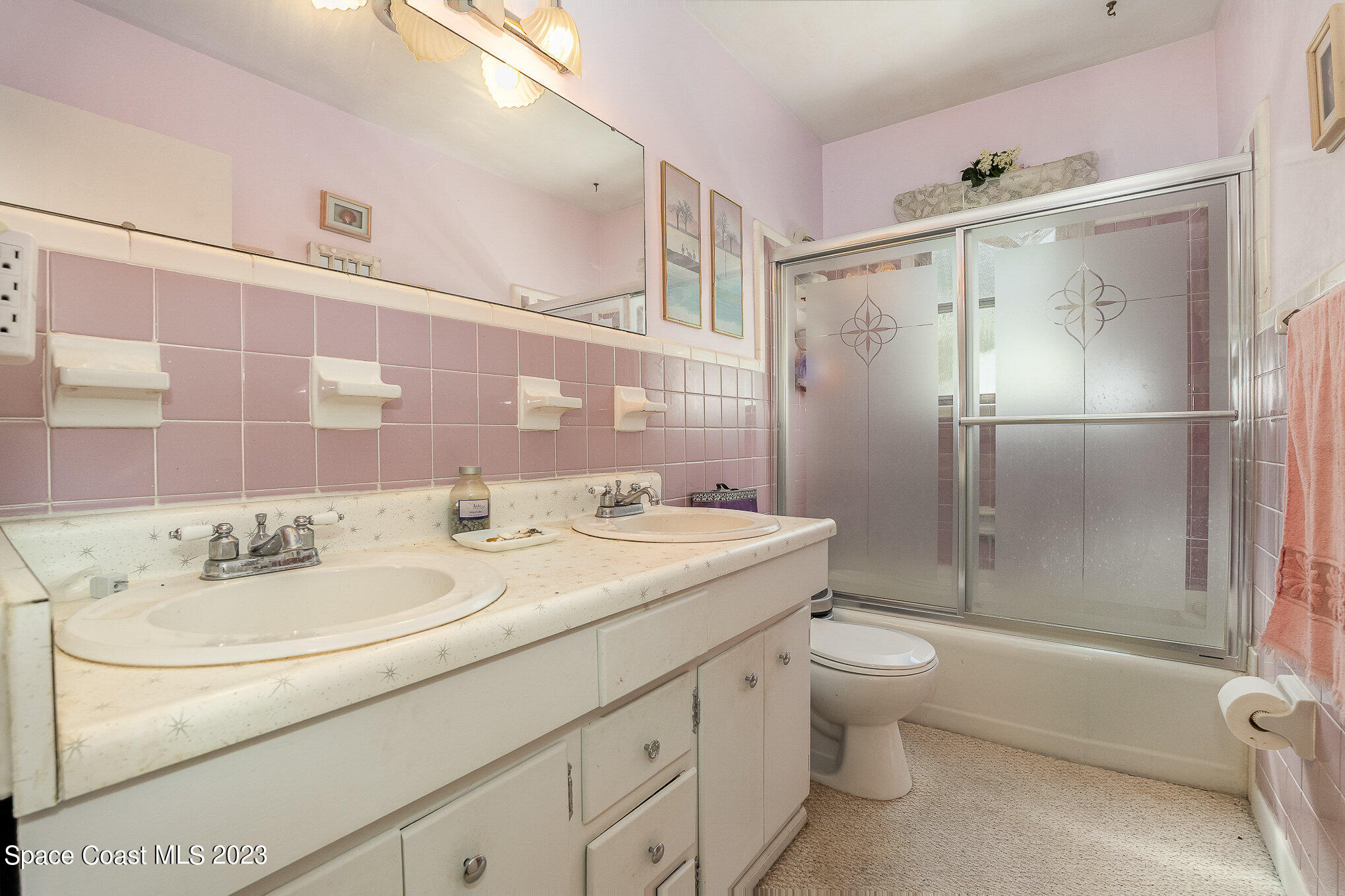 3395 Turtle Mound Road Melbourne, FL 32934 - Photo 24 of 48 a bathroom with a sink toilet and shower