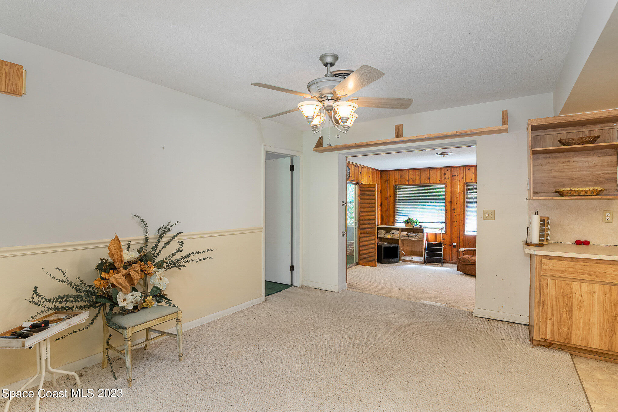 3395 Turtle Mound Road Melbourne, FL 32934 - Photo 28 of 48 a view of a livingroom with a chandelier furniture and living room view