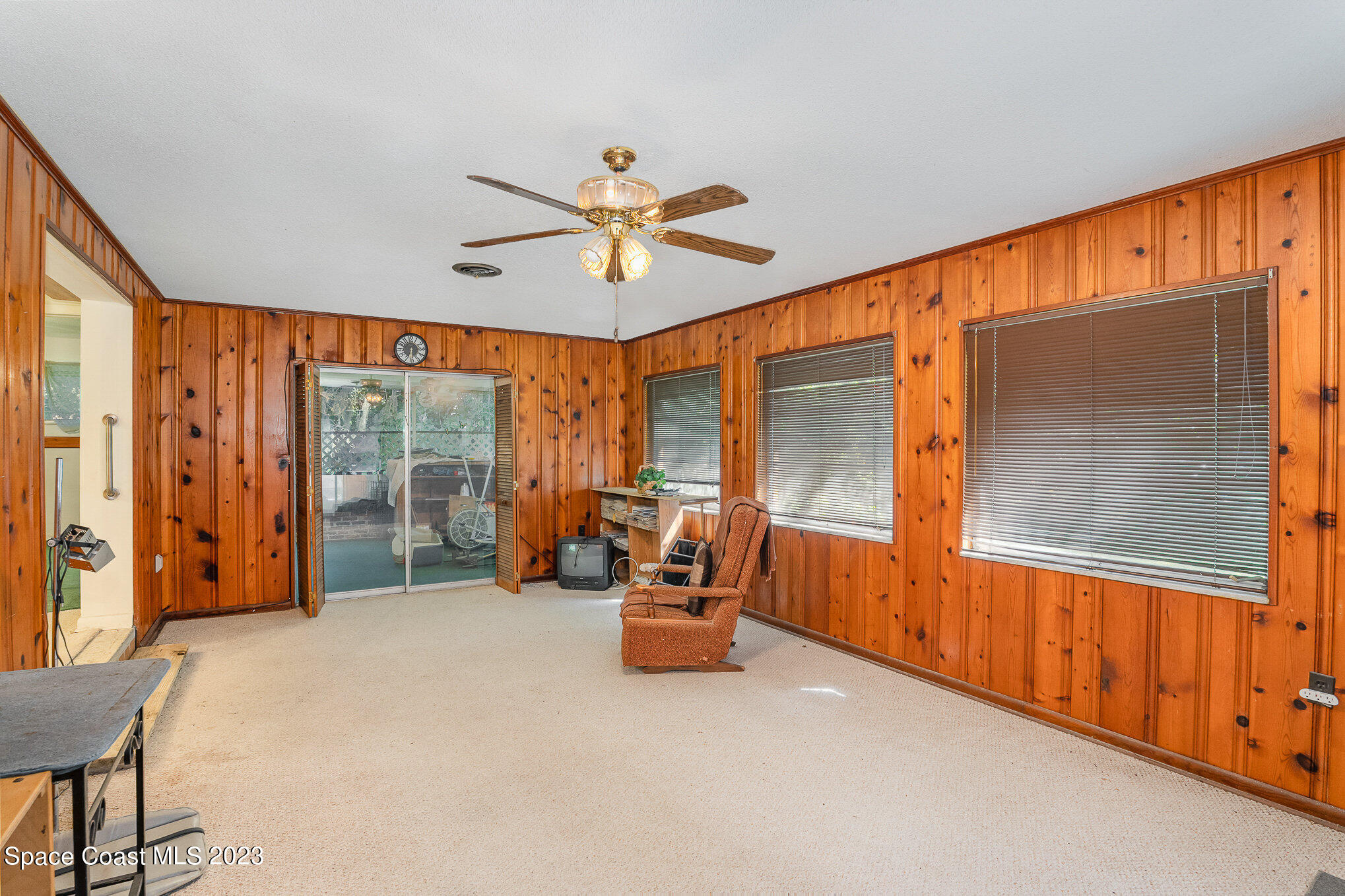 3395 Turtle Mound Road Melbourne, FL 32934 - Photo 34 of 48 a living room with furniture and a large window