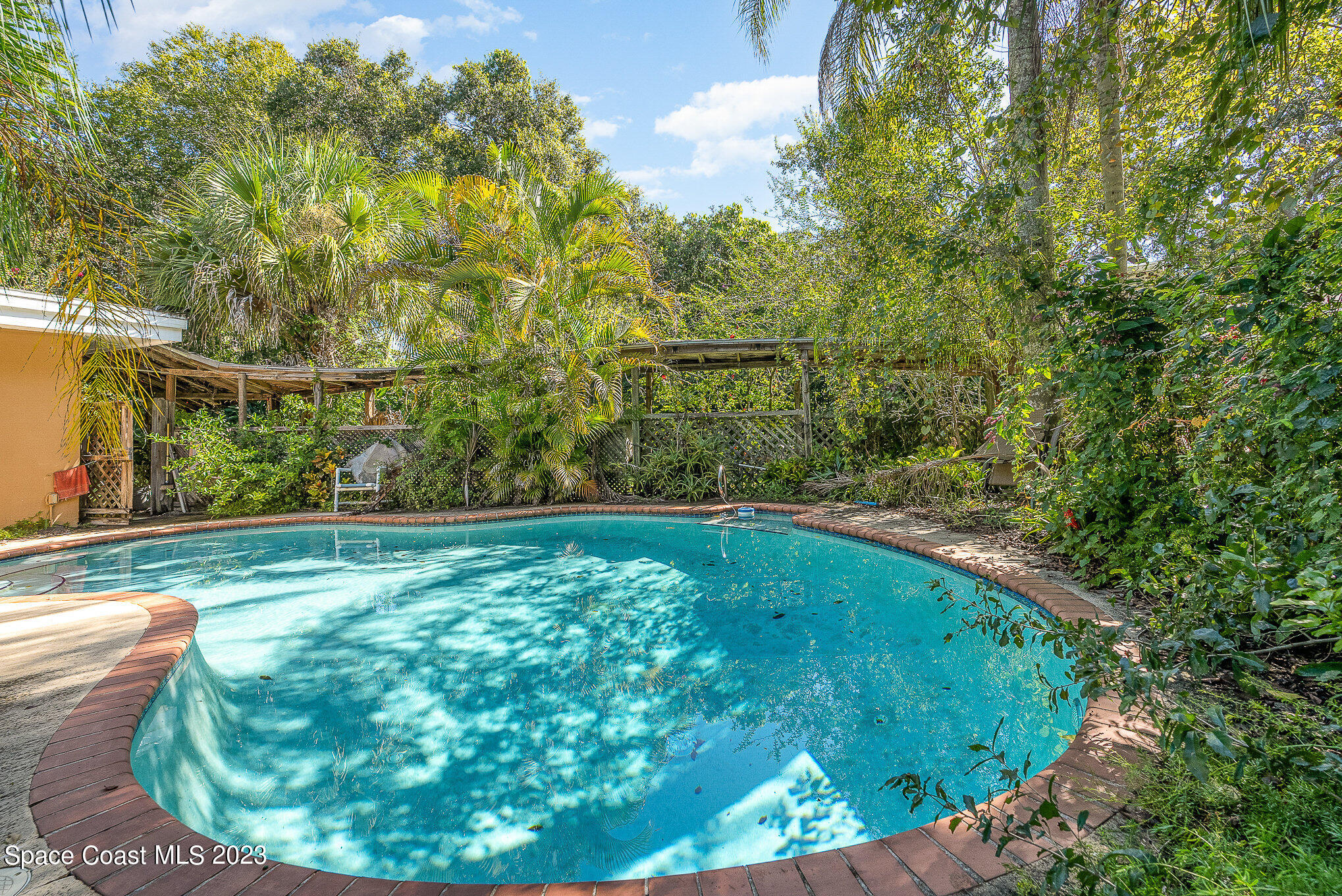 3395 Turtle Mound Road Melbourne, FL 32934 - Photo 36 of 48 a view of a back yard from a tub