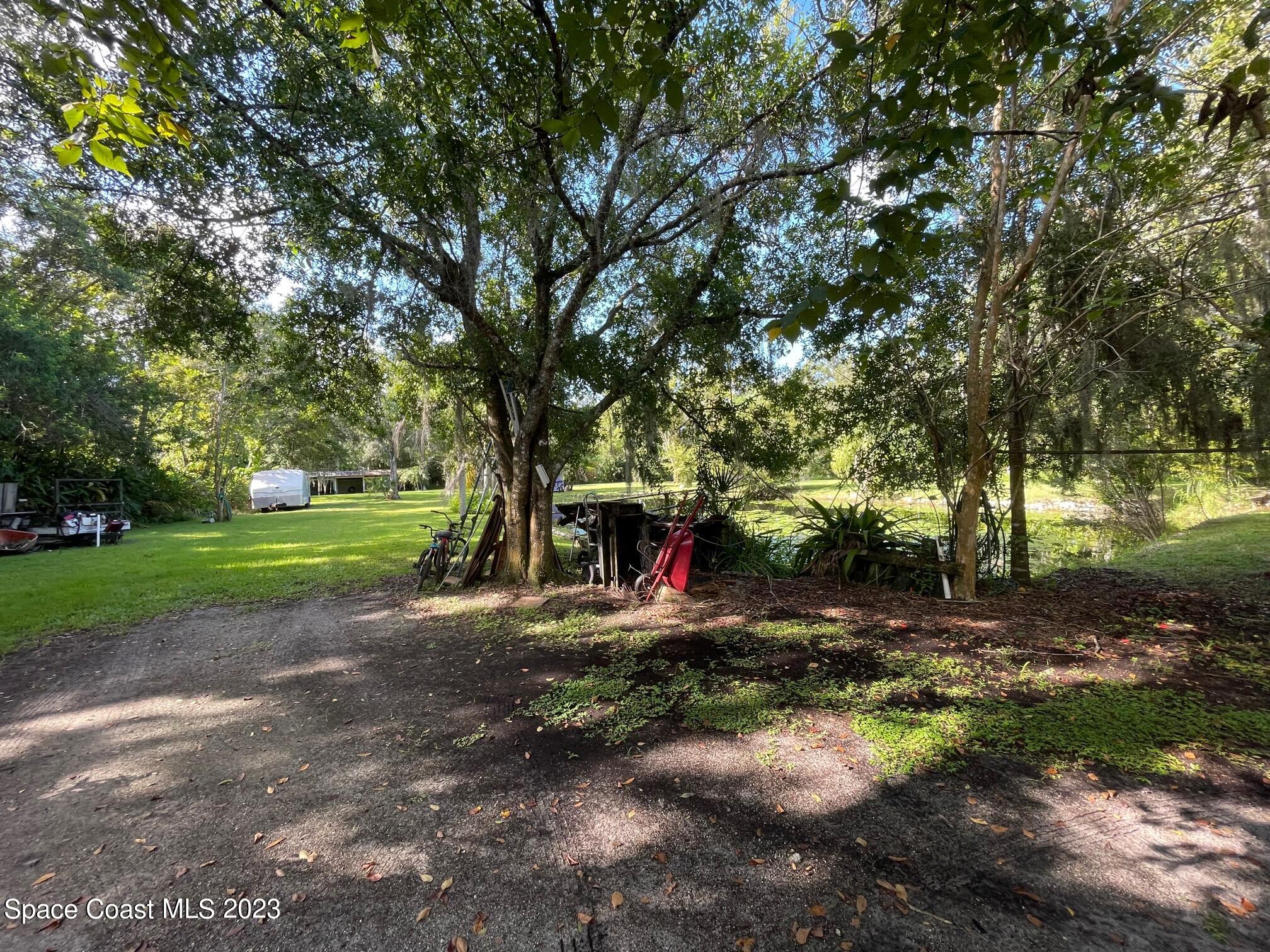3395 Turtle Mound Road Melbourne, FL 32934 - Photo 40 of 48 a view of outdoor space with playground and green space