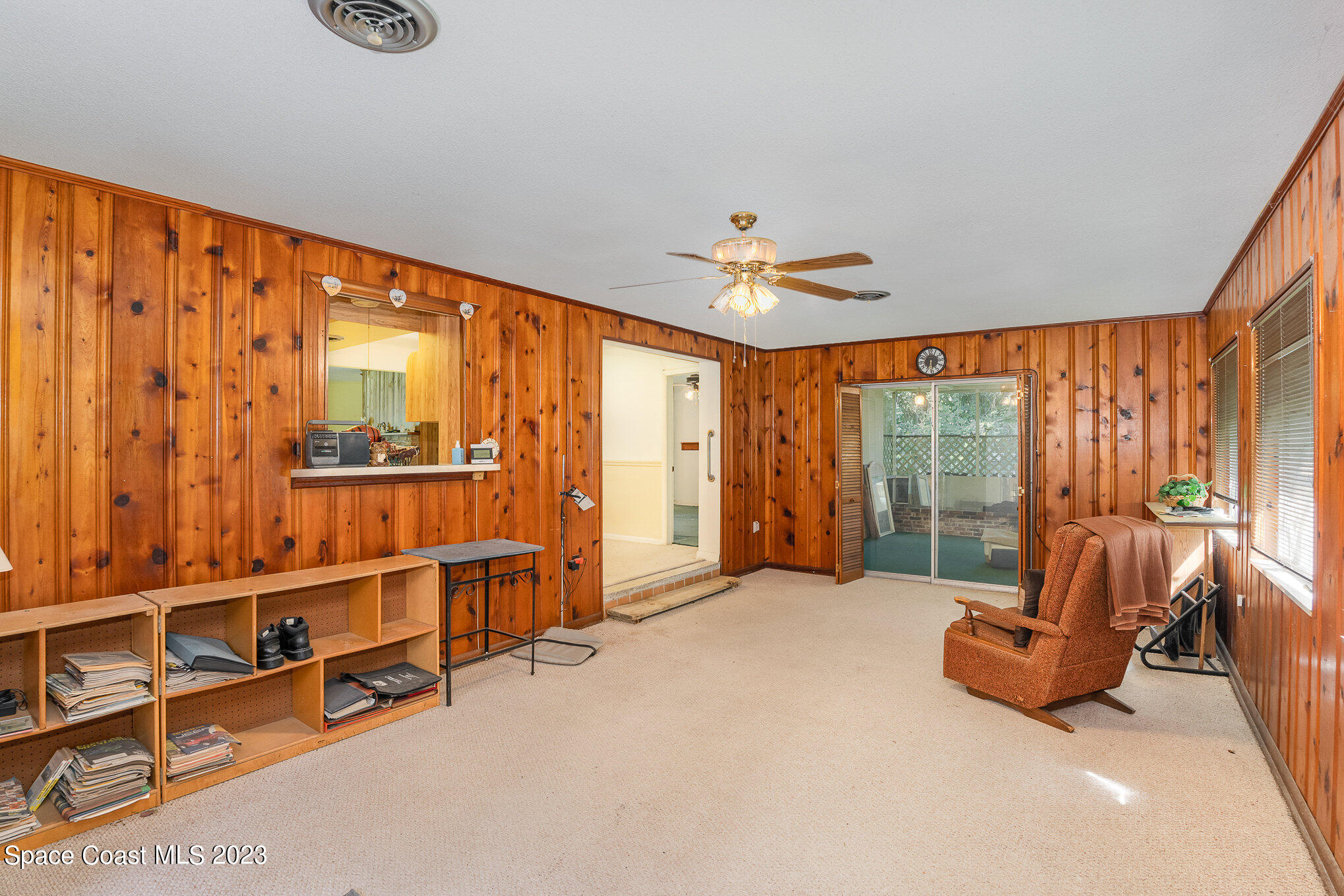 3395 Turtle Mound Road Melbourne, FL 32934 - Photo 5 of 48 a view of an empty room with windows