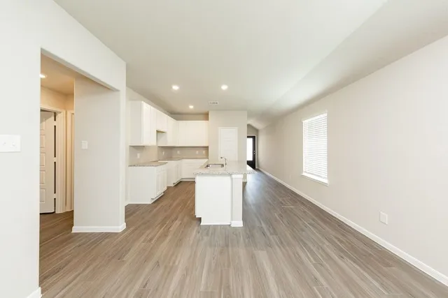 a view of kitchen with wooden floor