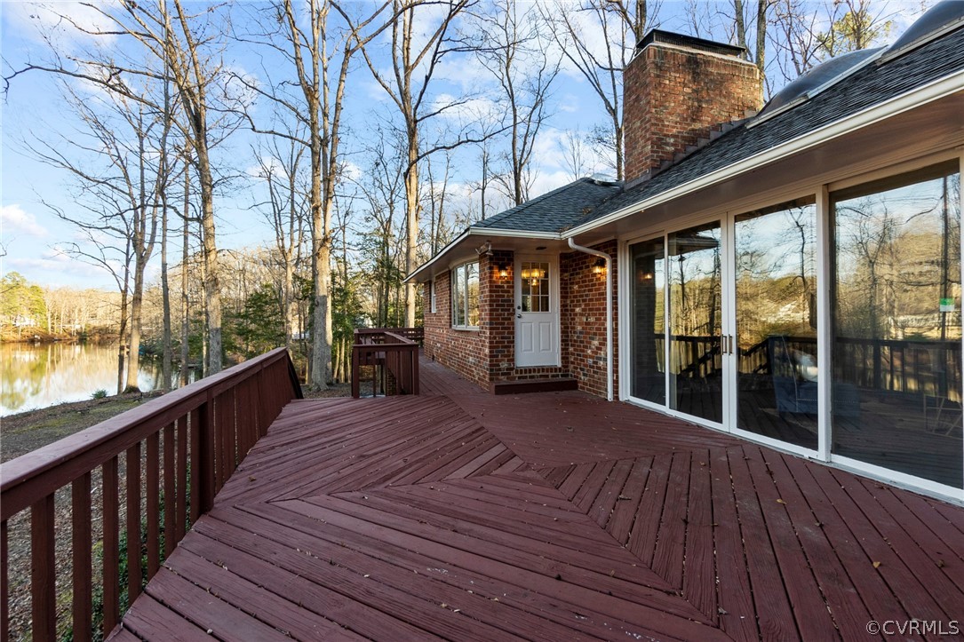 4620 Crossgate Road Chester, VA 23831 - Photo 45 of 49 What a place to enjoy the afternoon sun overlooking peaceful Rieves Lake! The main deck has access from the kitchen, primary suite, family room and screeend porch!!