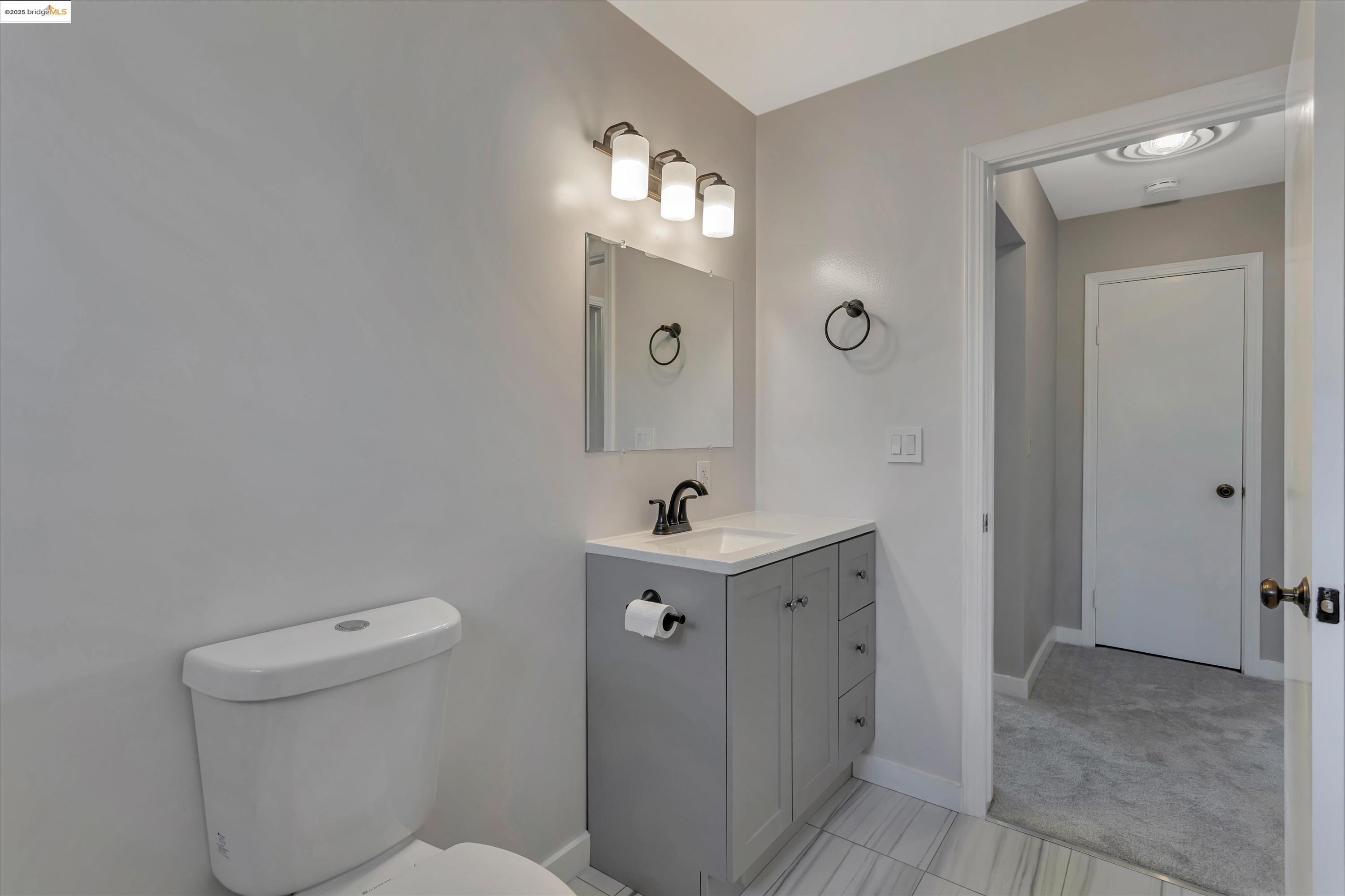 840 Sevely Drive Mountain View, CA 94041 - Photo 17 of 19 a bathroom with a sink a toilet and mirror