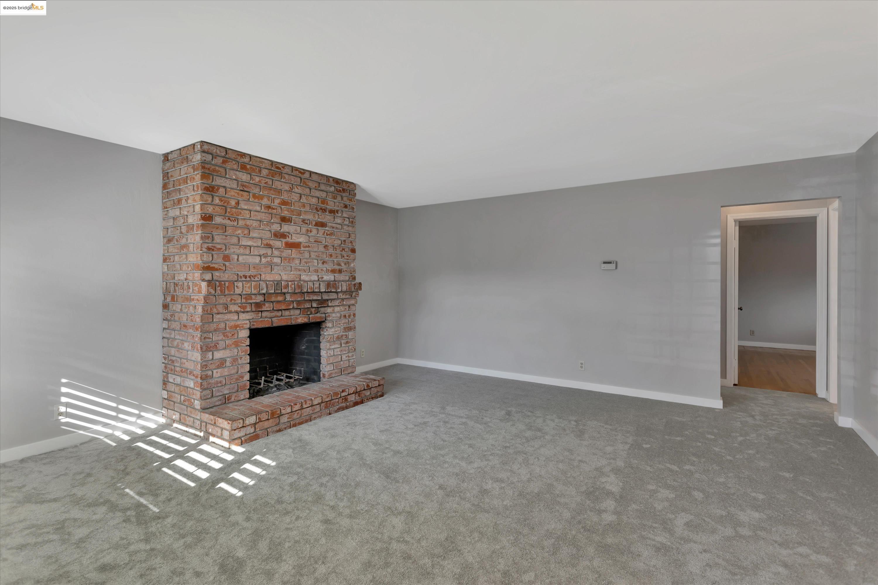 840 Sevely Drive Mountain View, CA 94041 - Photo 5 of 19 a view of an empty room with a fireplace