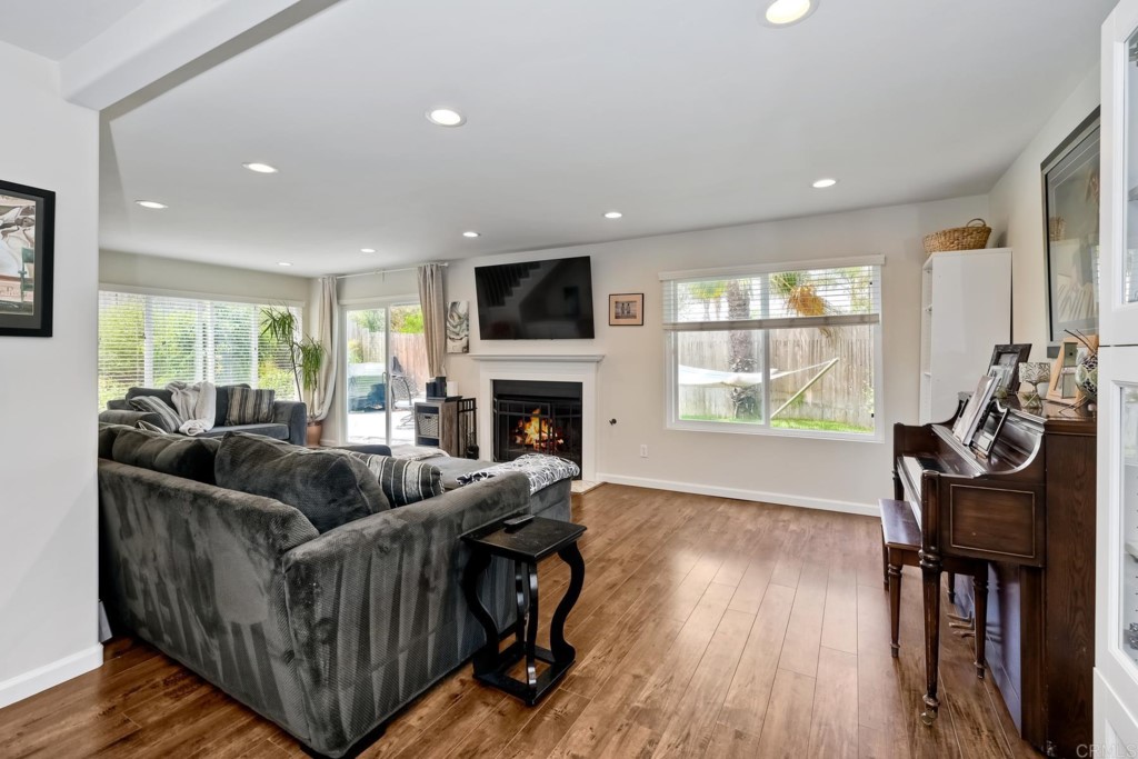 2425-27 Torrejon Place Carlsbad, CA 92009 - Photo 26 of 59 a living room with furniture and a flat screen tv