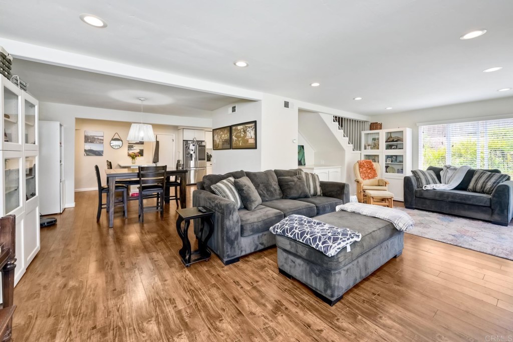 2425-27 Torrejon Place Carlsbad, CA 92009 - Photo 29 of 59 a living room with furniture and a wooden floor