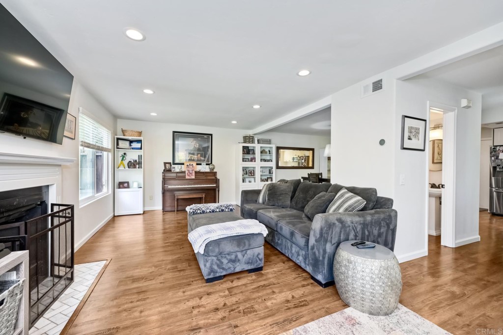2425-27 Torrejon Place Carlsbad, CA 92009 - Photo 32 of 59 a living room with furniture and a flat screen tv