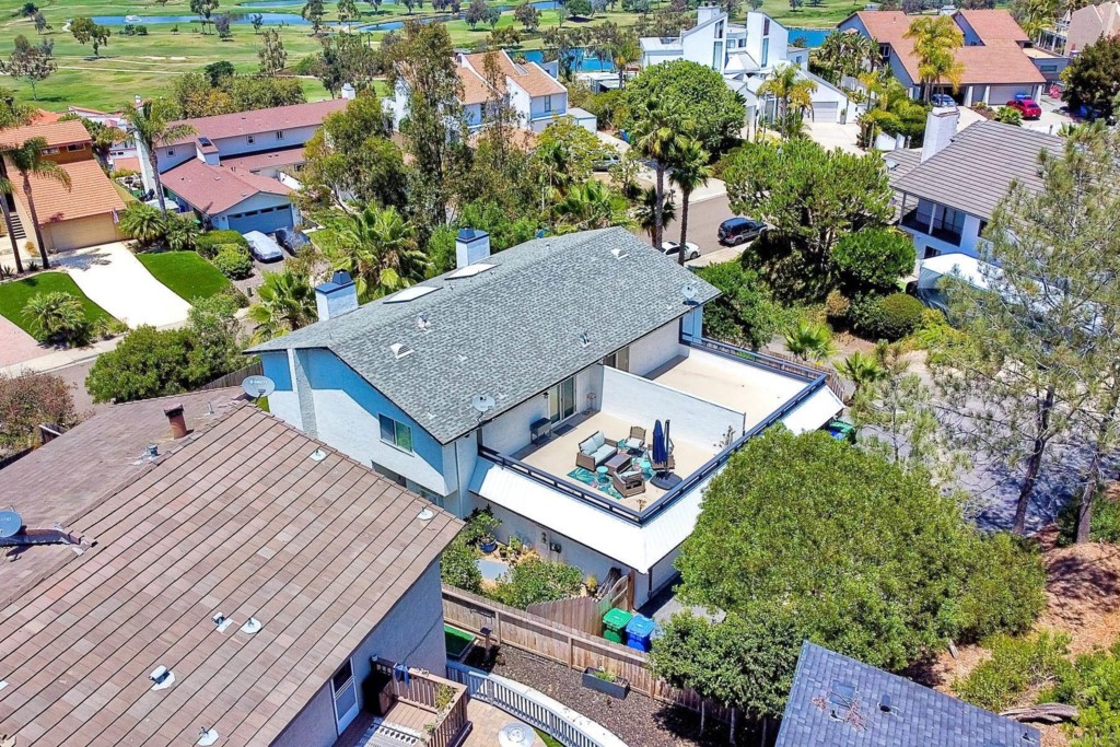 2425-27 Torrejon Place Carlsbad, CA 92009 - Photo 50 of 59 an aerial view of a house with a yard and lake view