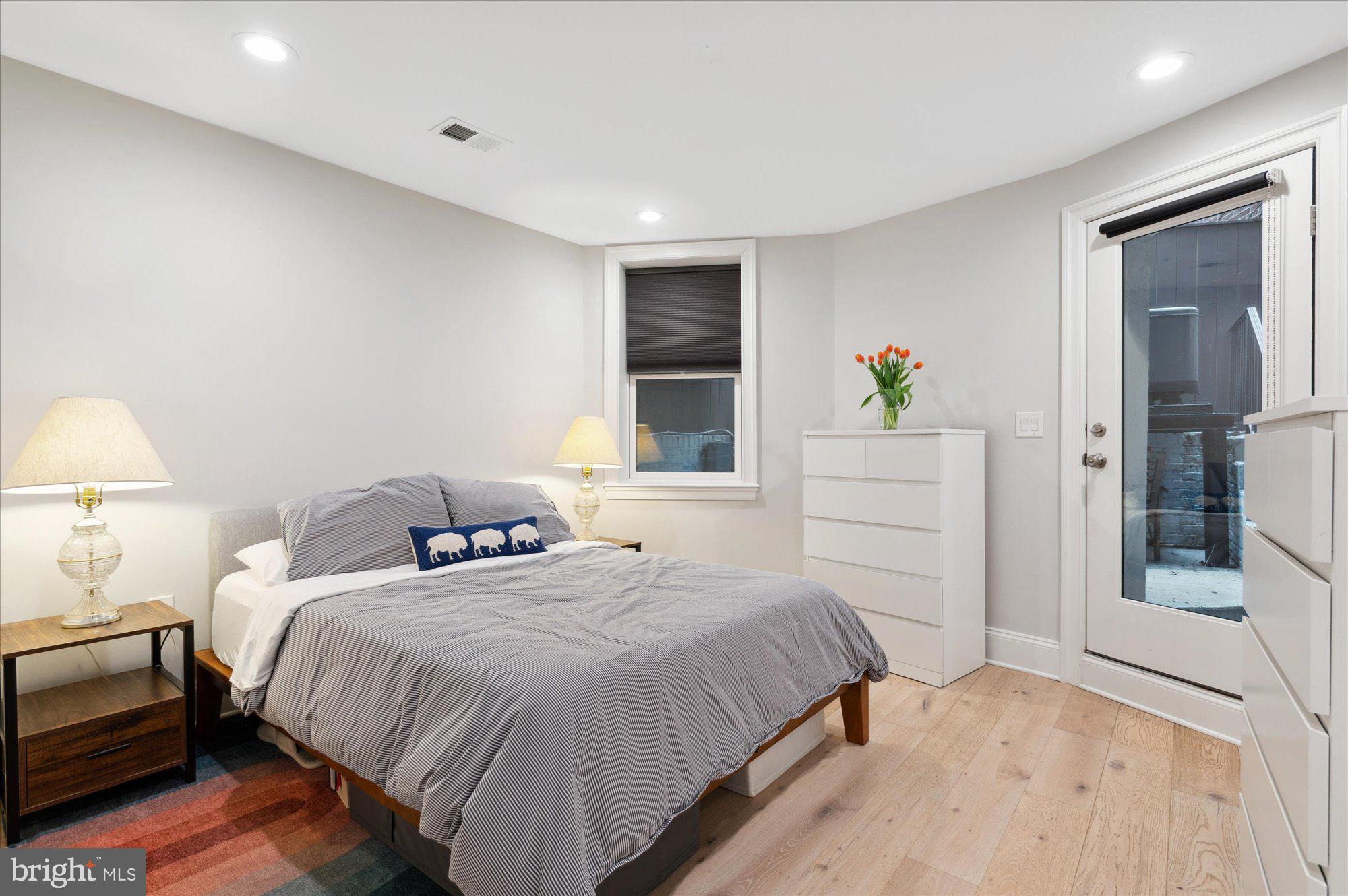 2150 Florida Avenue Northwest, Unit 1 Washington, DC 20008 - Photo 10 of 23 a bedroom with a bed and a window
