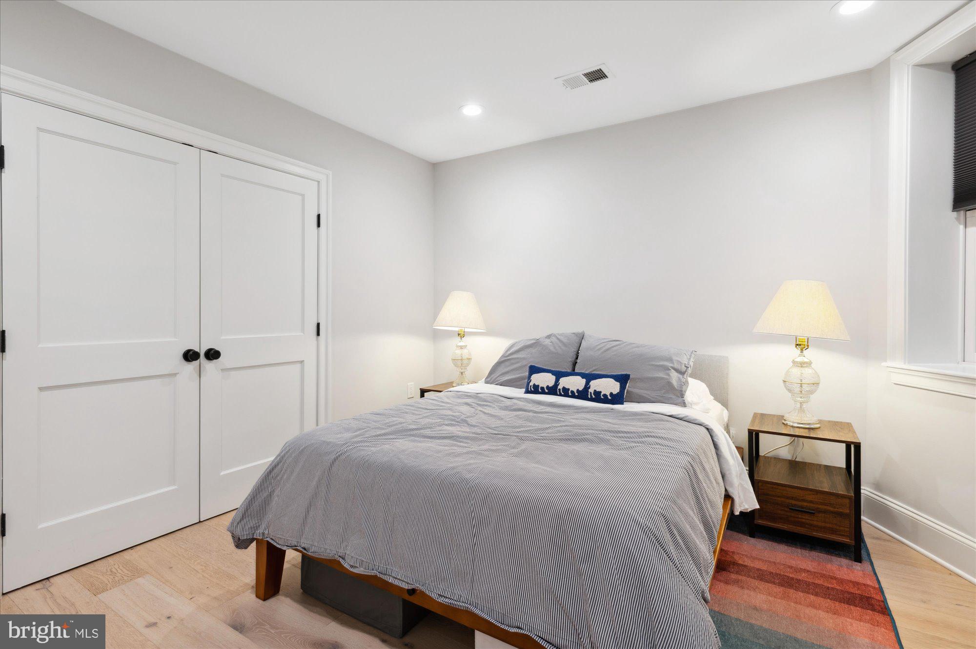 2150 Florida Avenue Northwest, Unit 1 Washington, DC 20008 - Photo 11 of 23 a bedroom with a bed and a lamp