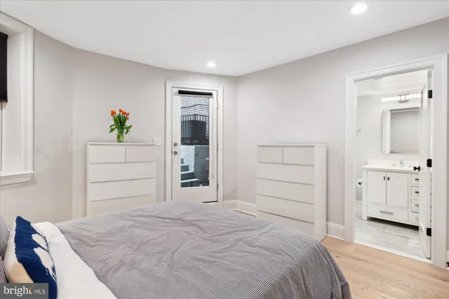 a bedroom with a bed and a dresser