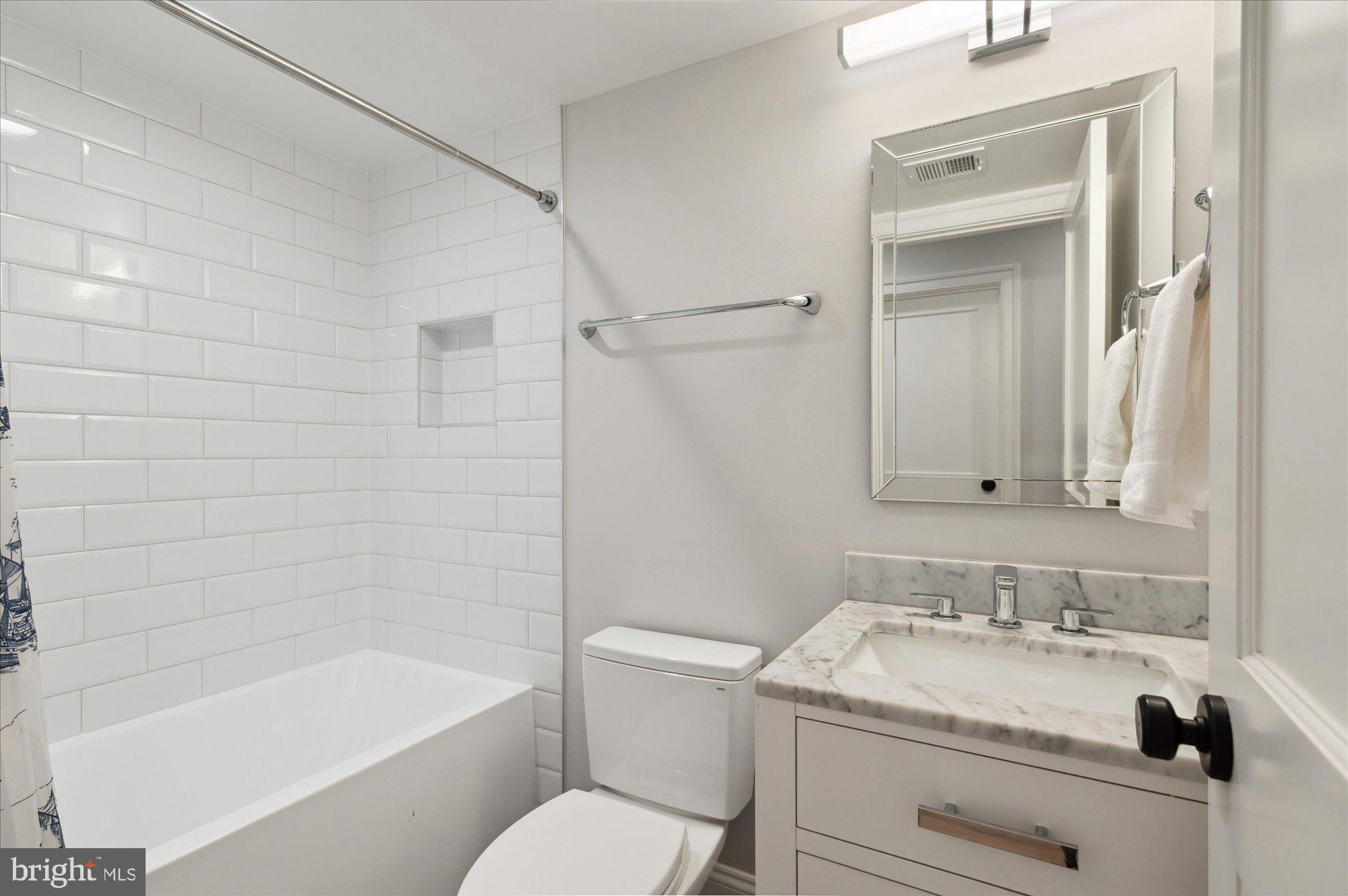 2150 Florida Avenue Northwest, Unit 1 Washington, DC 20008 - Photo 15 of 23 a bathroom with a granite countertop sink toilet and shower