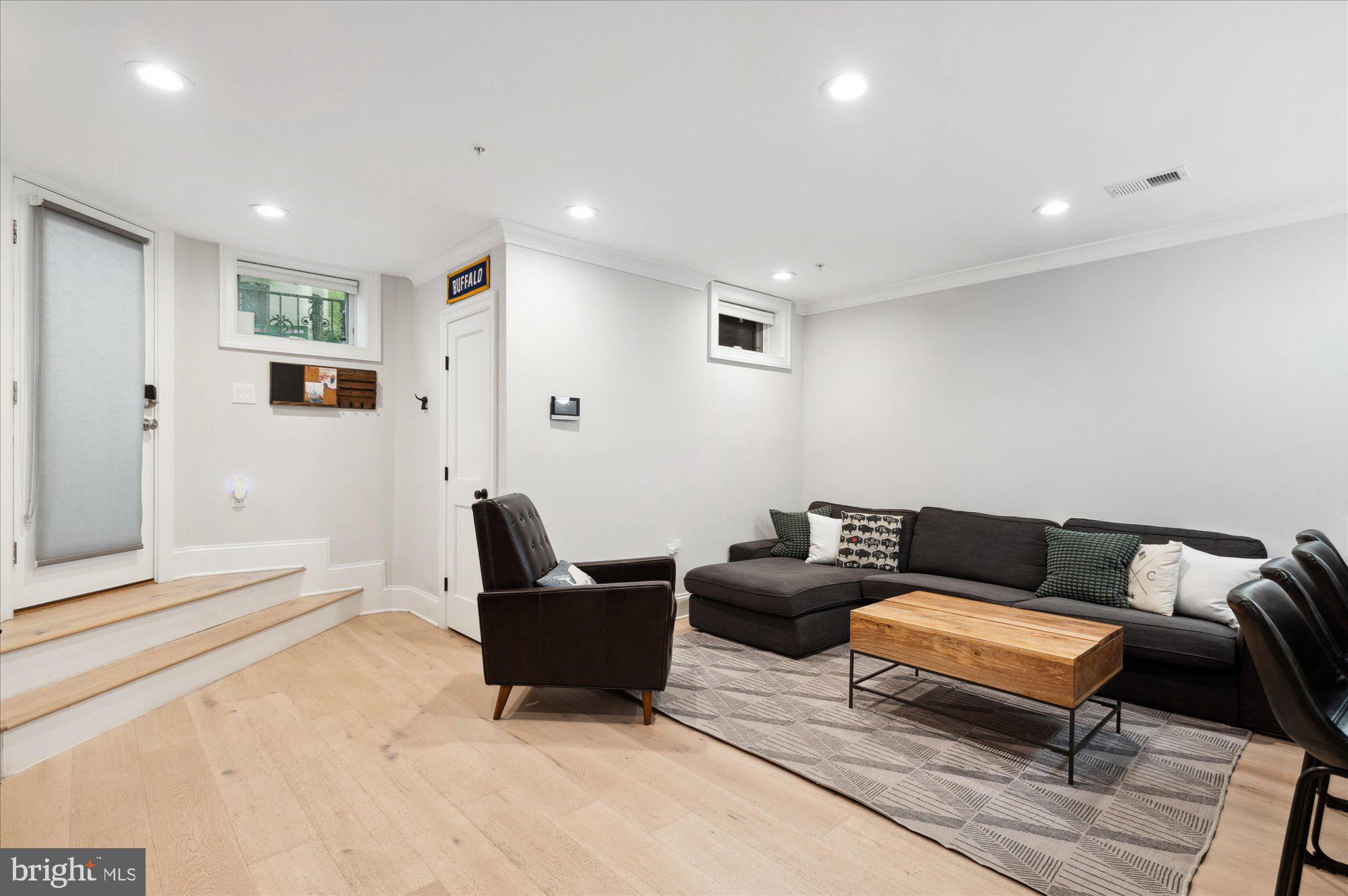2150 Florida Avenue Northwest, Unit 1 Washington, DC 20008 - Photo 3 of 23 a living room with furniture and a rug