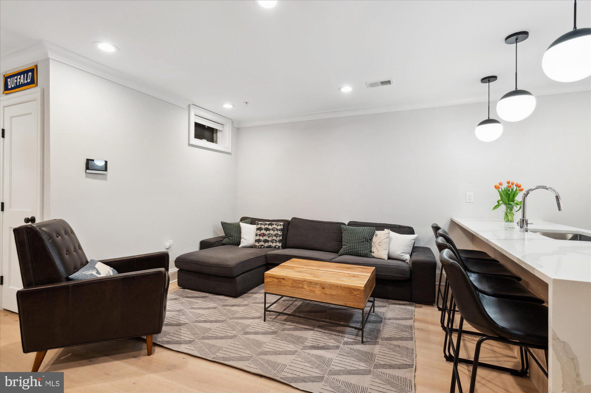 2150 Florida Avenue Northwest, Unit 1 Washington, DC 20008 - Photo 4 of 23 a living room with furniture and wooden floor