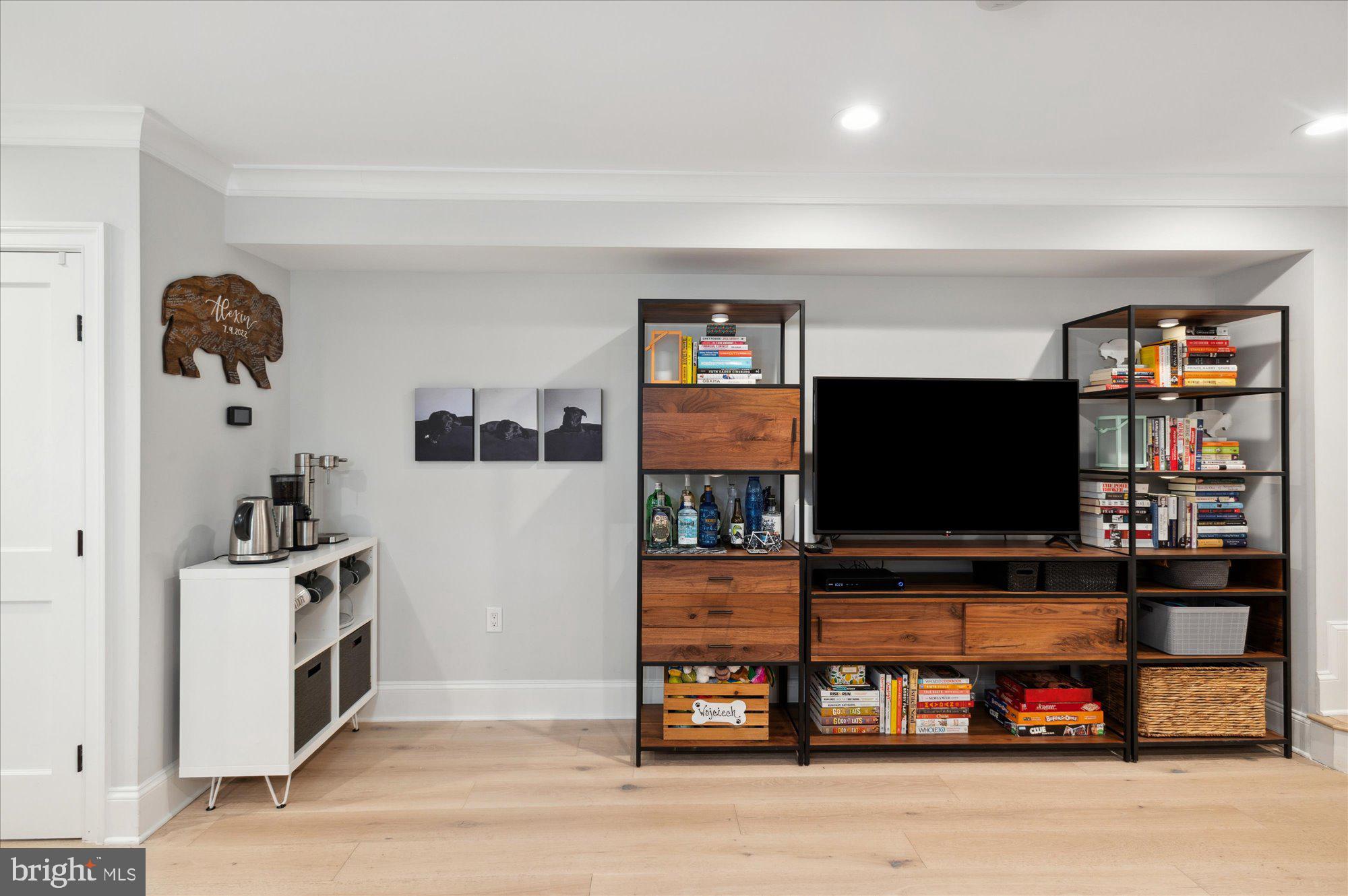 2150 Florida Avenue Northwest, Unit 1 Washington, DC 20008 - Photo 7 of 23 a living room with furniture and a flat screen tv