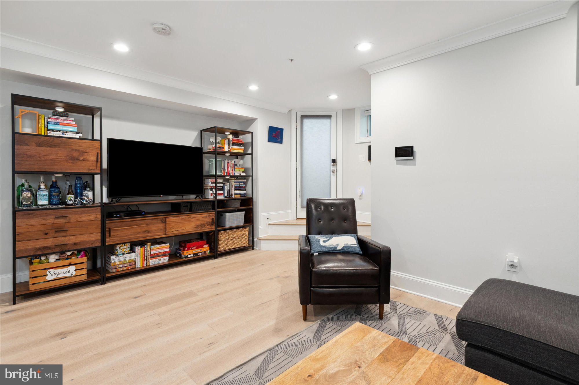 2150 Florida Avenue Northwest, Unit 1 Washington, DC 20008 - Photo 8 of 23 a living room with furniture and a flat screen tv
