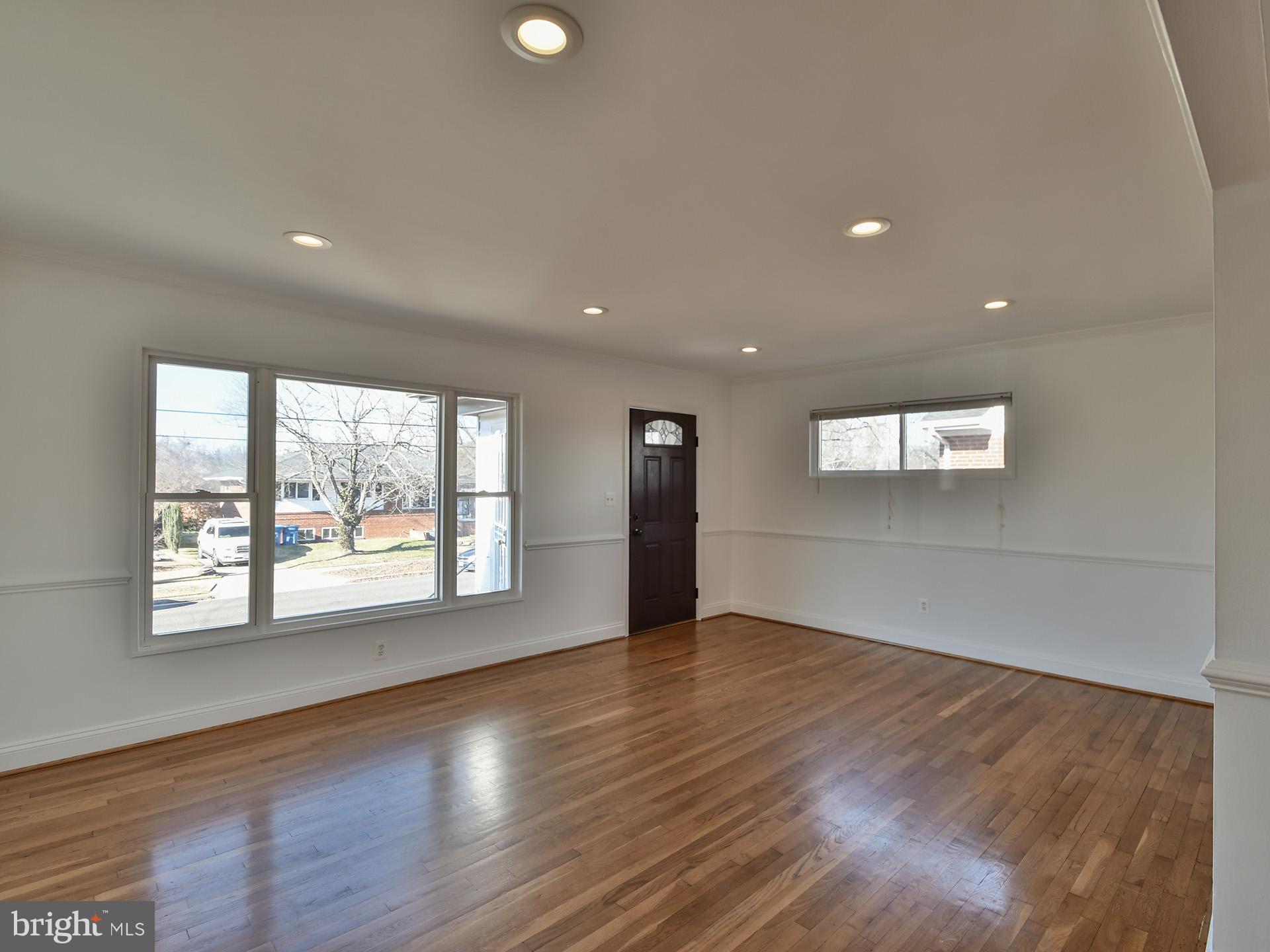 2308 Senator Avenue District Heights, MD 20747 - Photo 16 of 66 an empty room with wooden floor and windows