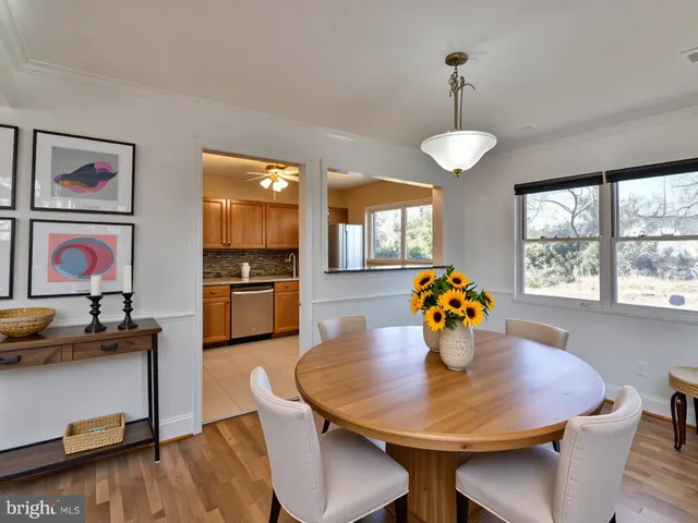 a kitchen with stainless steel appliances granite countertop a stove sink and cabinets