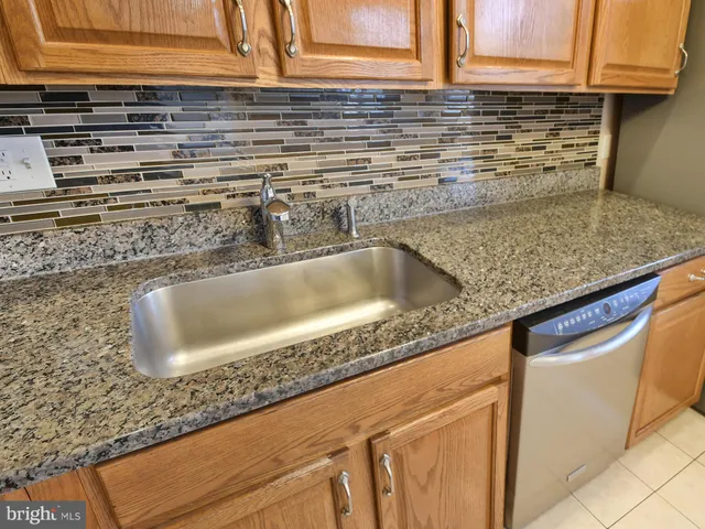 a view of a room with wooden floor and windows