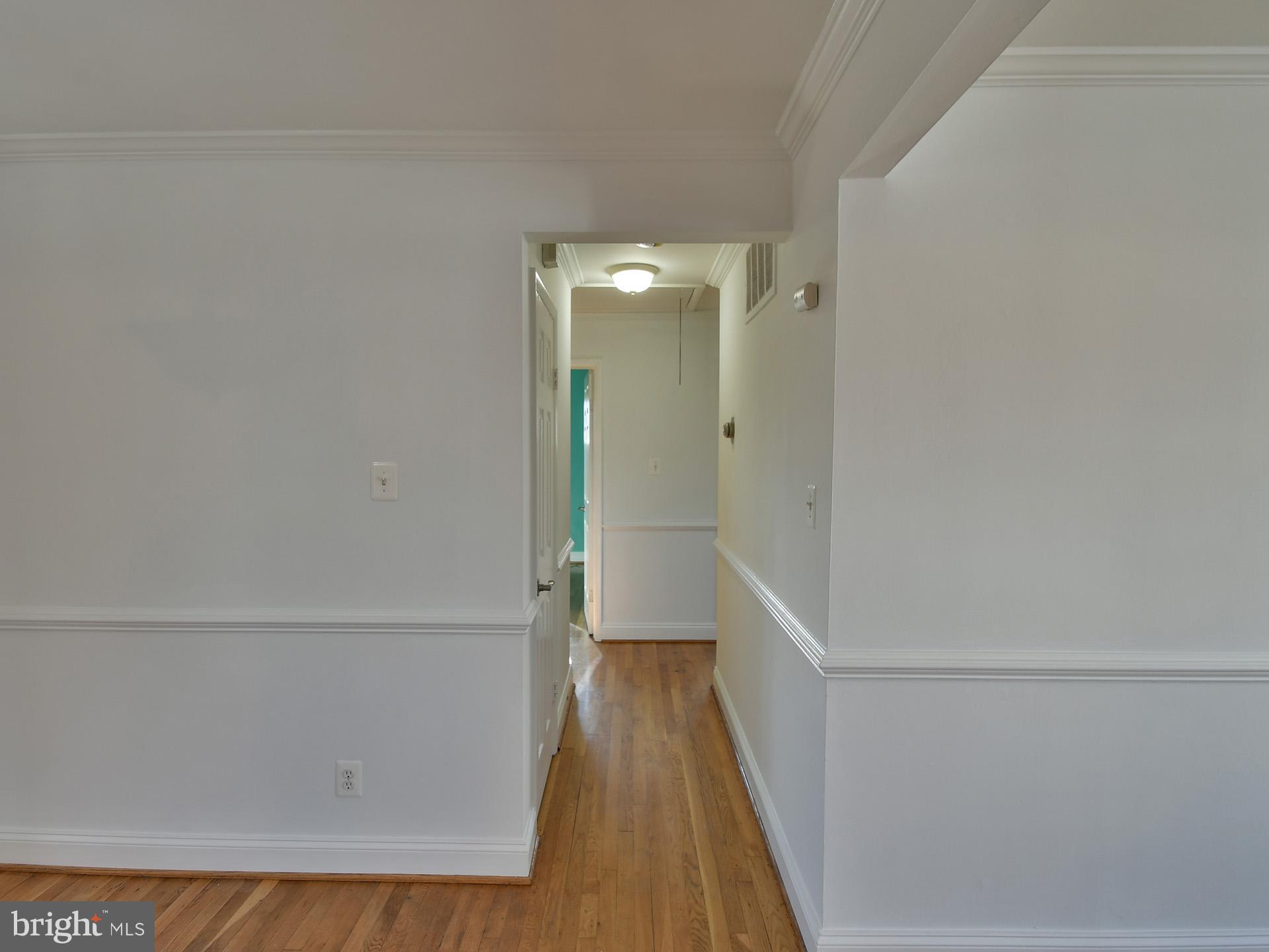 2308 Senator Avenue District Heights, MD 20747 - Photo 27 of 66 a view of a hallway with wooden floor