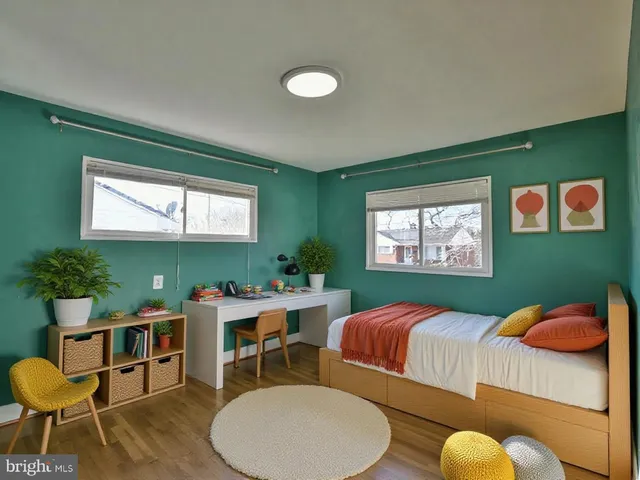 an empty room with wooden floor and closet
