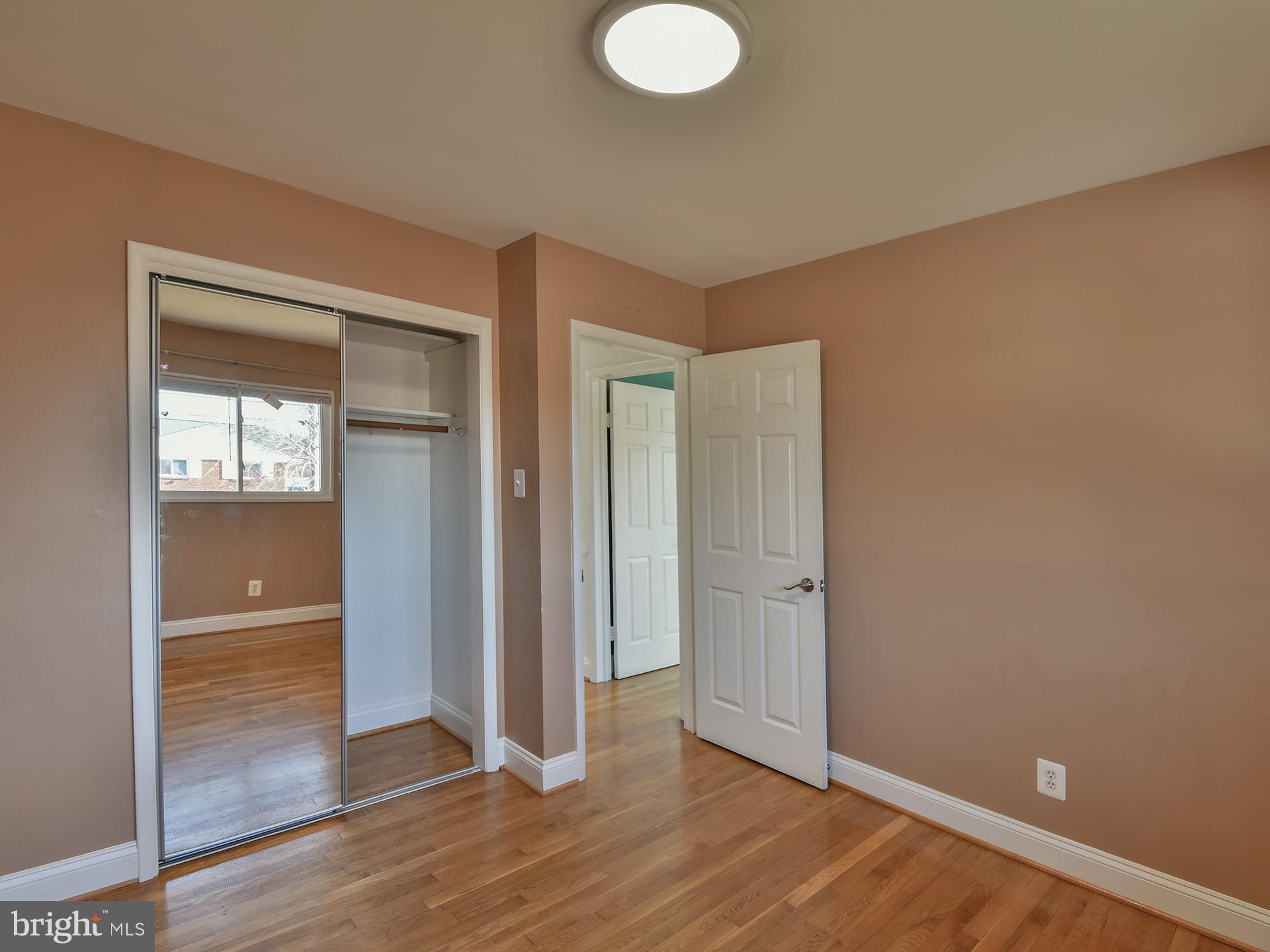 2308 Senator Avenue District Heights, MD 20747 - Photo 37 of 66 an empty room with wooden floor and closet
