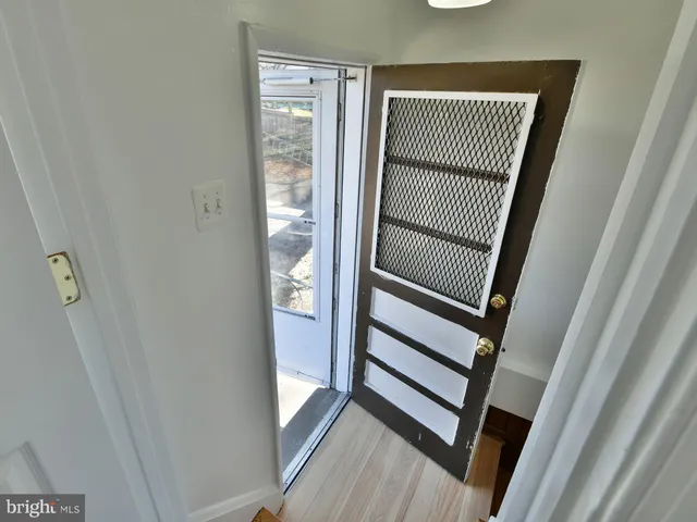 a view of a bathroom from a hallway