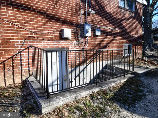 a black and white building with trees in front of it