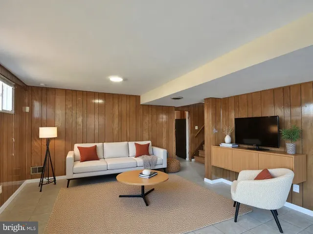 a view of a workspace with furniture and a potted plant