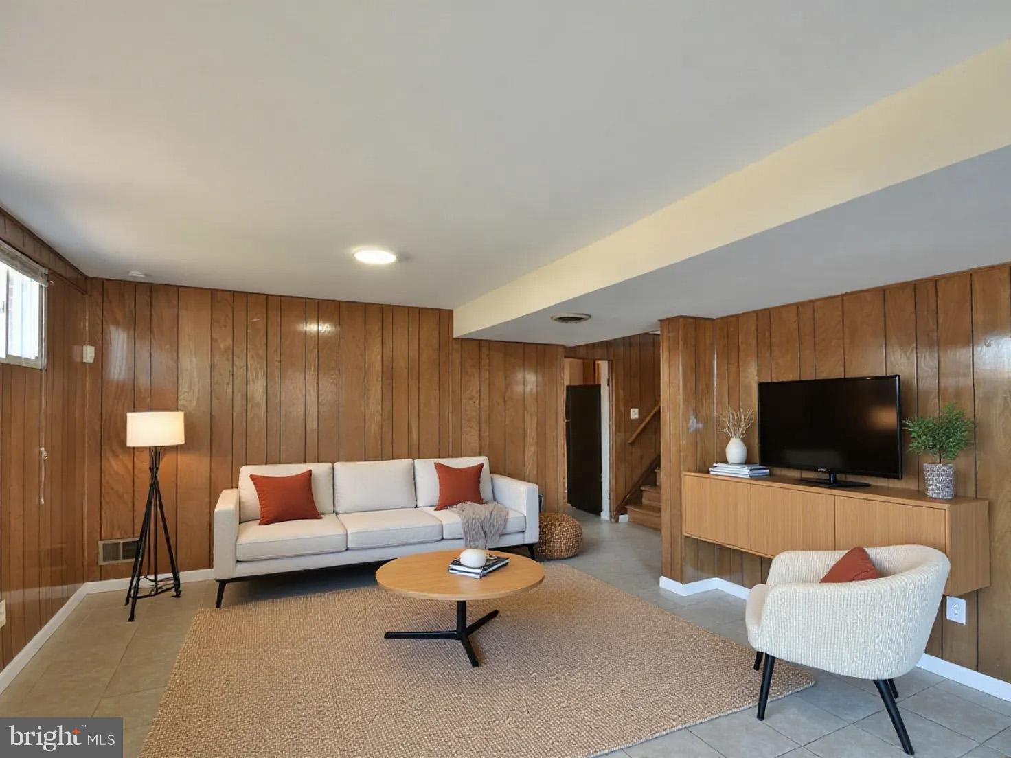 2308 Senator Avenue District Heights, MD 20747 - Photo 45 of 66 a living room with furniture and a flat screen tv