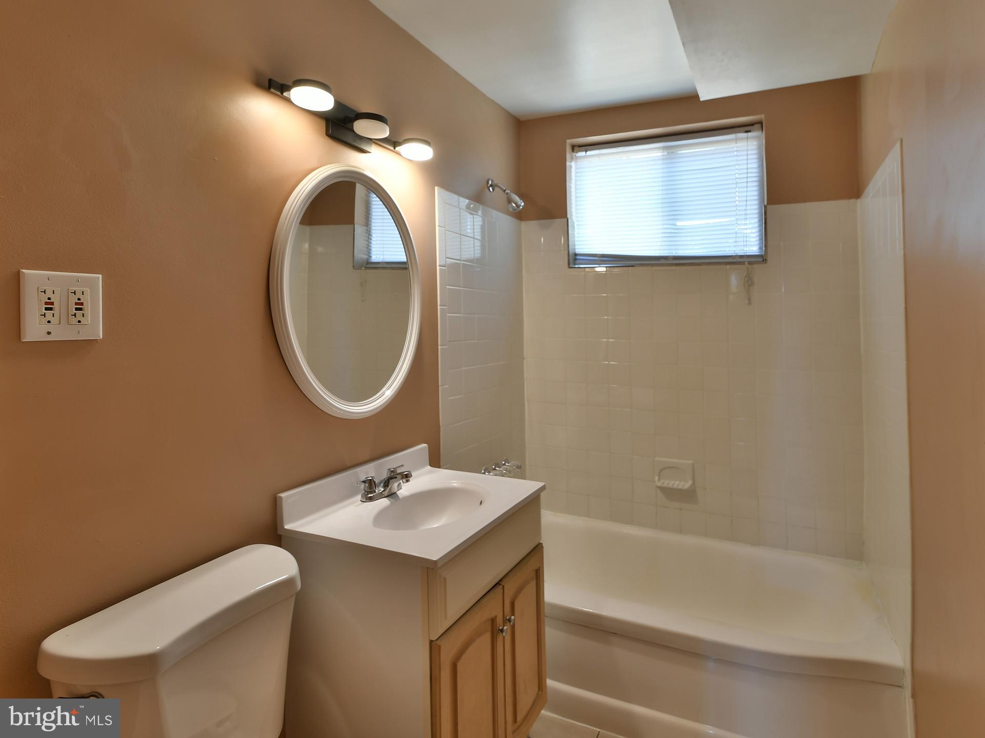 2308 Senator Avenue District Heights, MD 20747 - Photo 50 of 66 a bathroom with a toilet sink and mirror