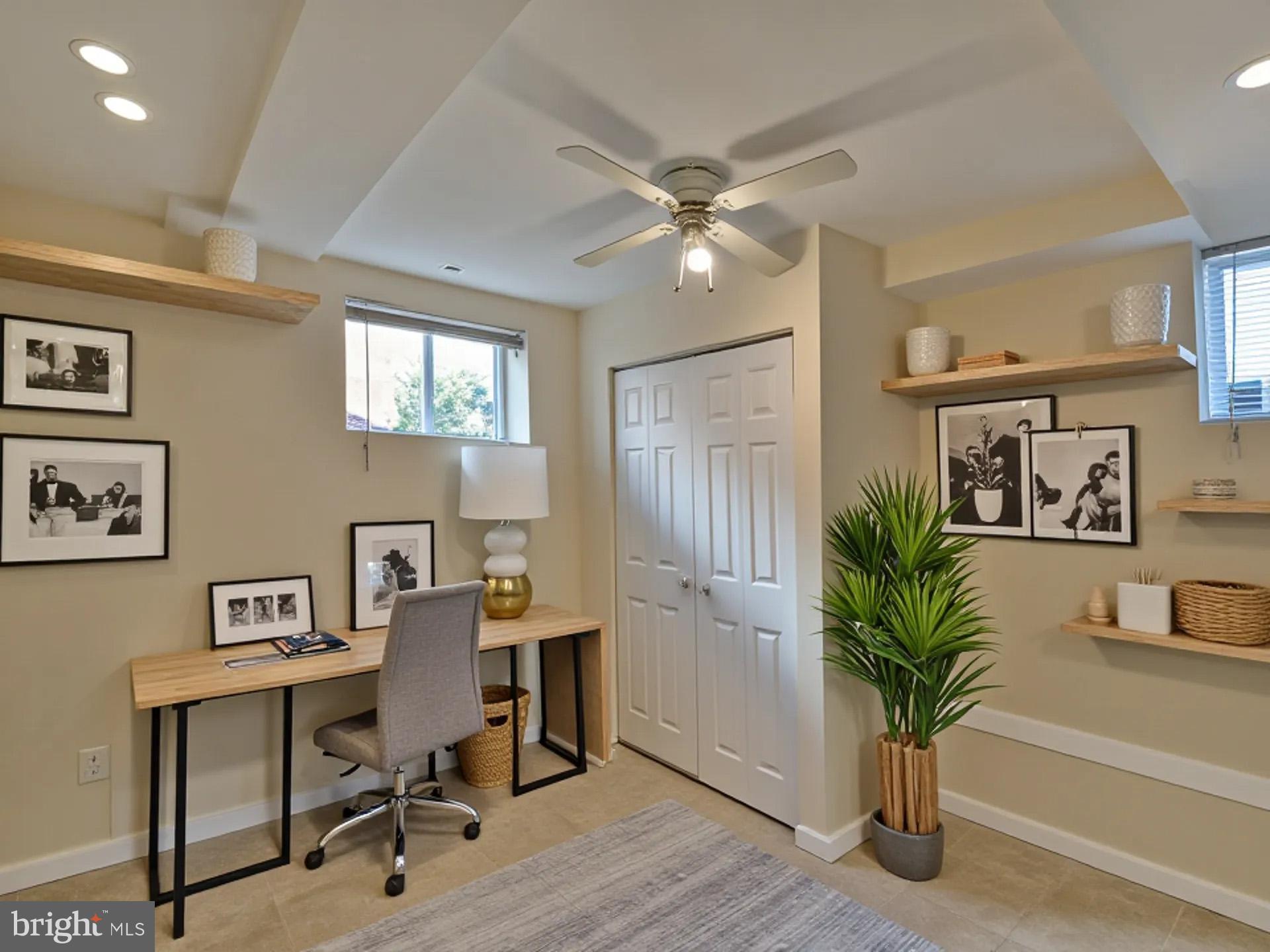 2308 Senator Avenue District Heights, MD 20747 - Photo 56 of 66 a view of a workspace with furniture and a potted plant