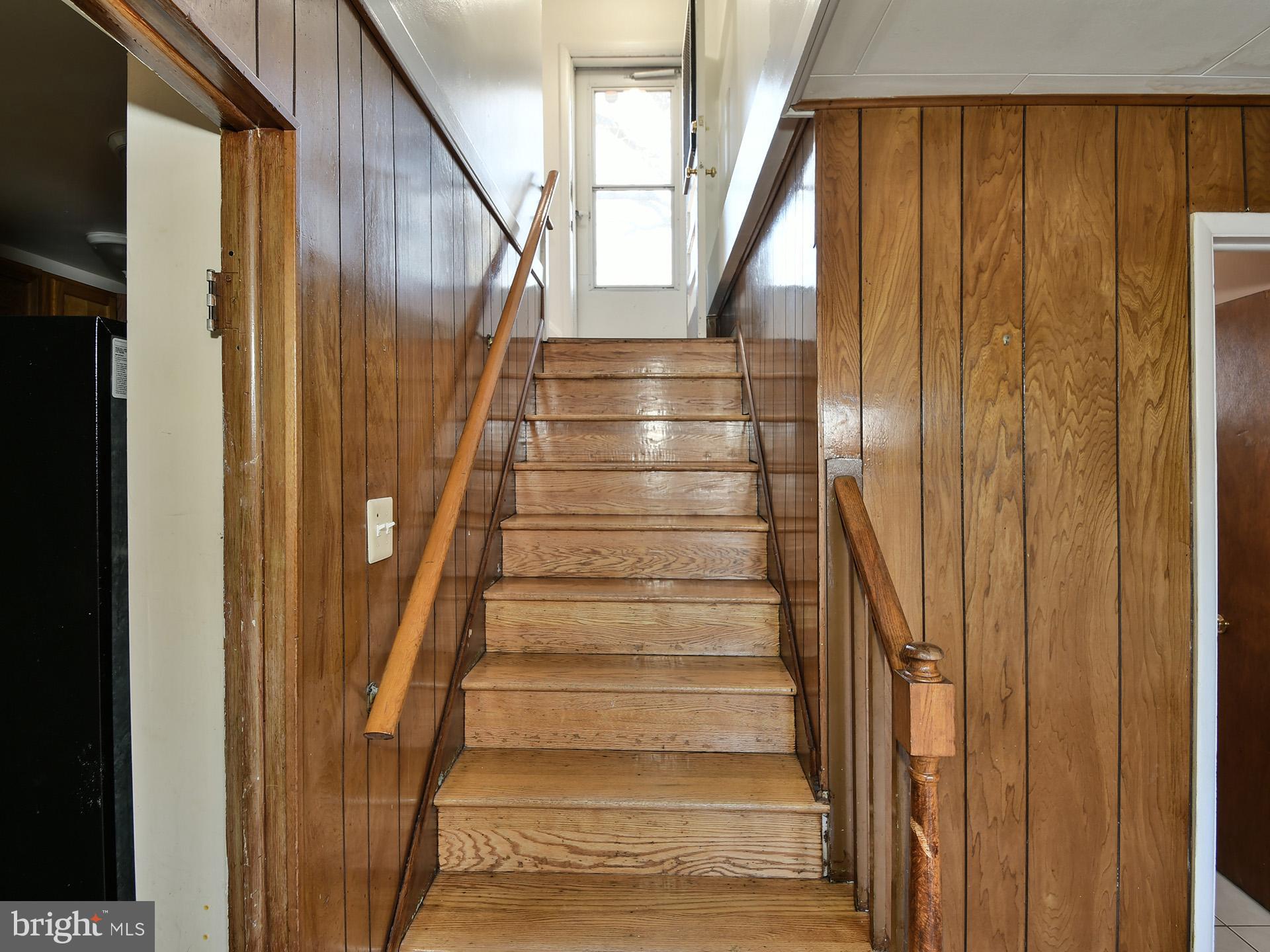 2308 Senator Avenue District Heights, MD 20747 - Photo 64 of 66 a view of staircase with wooden floor and white walls