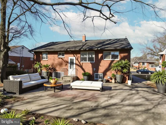 a view of a brick house with many windows