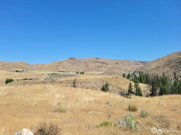 a view of a mountain view with mountains in the background