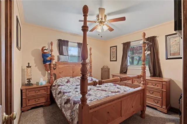 a bed room with a bed and a chandelier