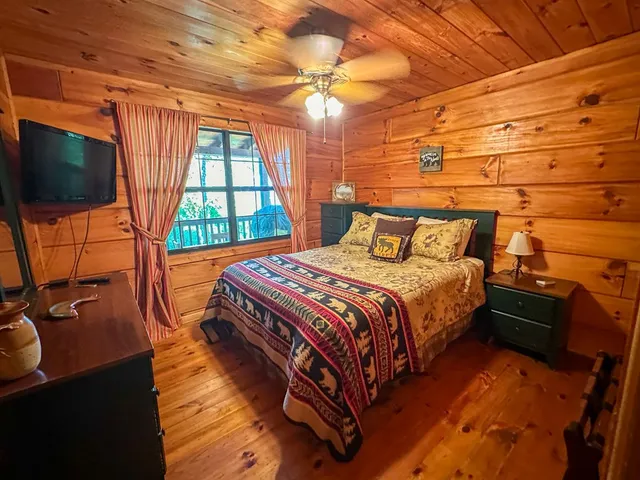 a bedroom with a bed and a dresser