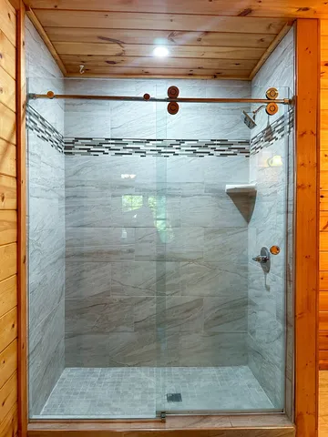 a bed room with a bed and a chair