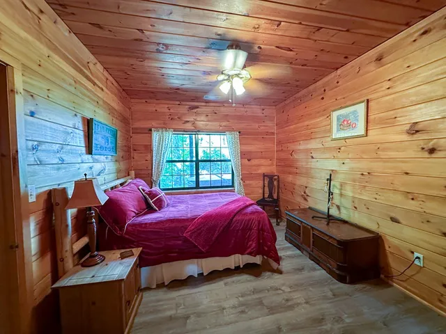 a bed room with a bed and a chandelier