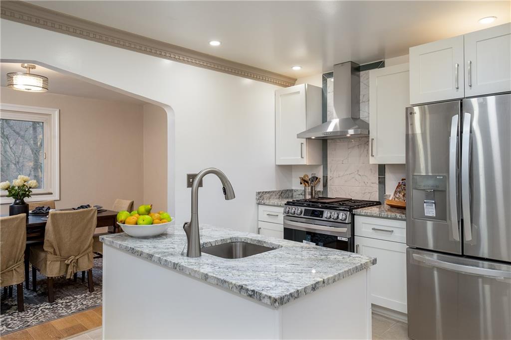 149 Three Degree Road Pittsburgh, PA 15237 - Photo 15 of 50 a kitchen with granite countertop a sink stainless steel appliances and cabinets