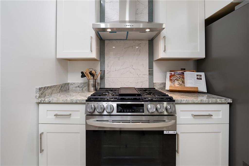 149 Three Degree Road Pittsburgh, PA 15237 - Photo 16 of 50 a stove top oven sitting inside of a kitchen