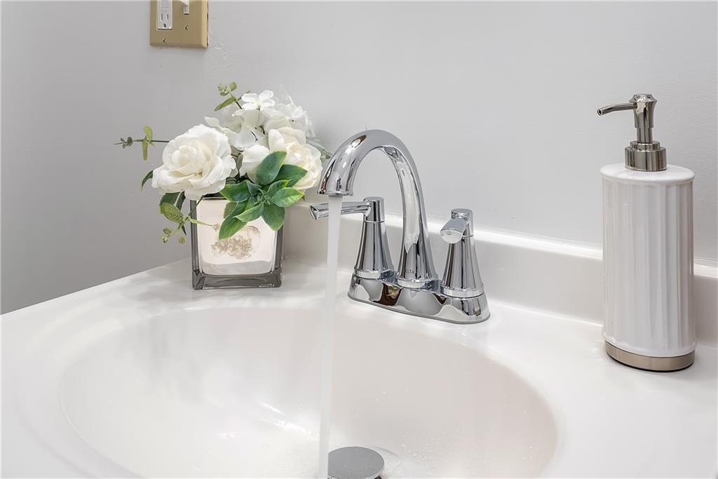 149 Three Degree Road Pittsburgh, PA 15237 - Photo 21 of 50 a glass vase with white flowers sitting on a table